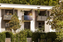 Modern Multi Apartment Building with Balconies and Landscape. Residential House with Landscaped Yard or Garden.